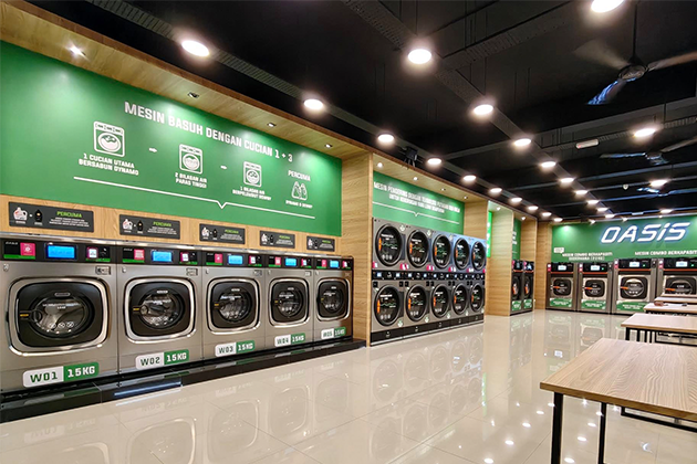 OASIS commercial stack washer dryer installed in an apartment laundry room