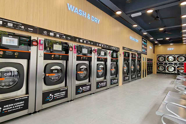 OASIS commercial laundry equipment in a neighborhood laundromat